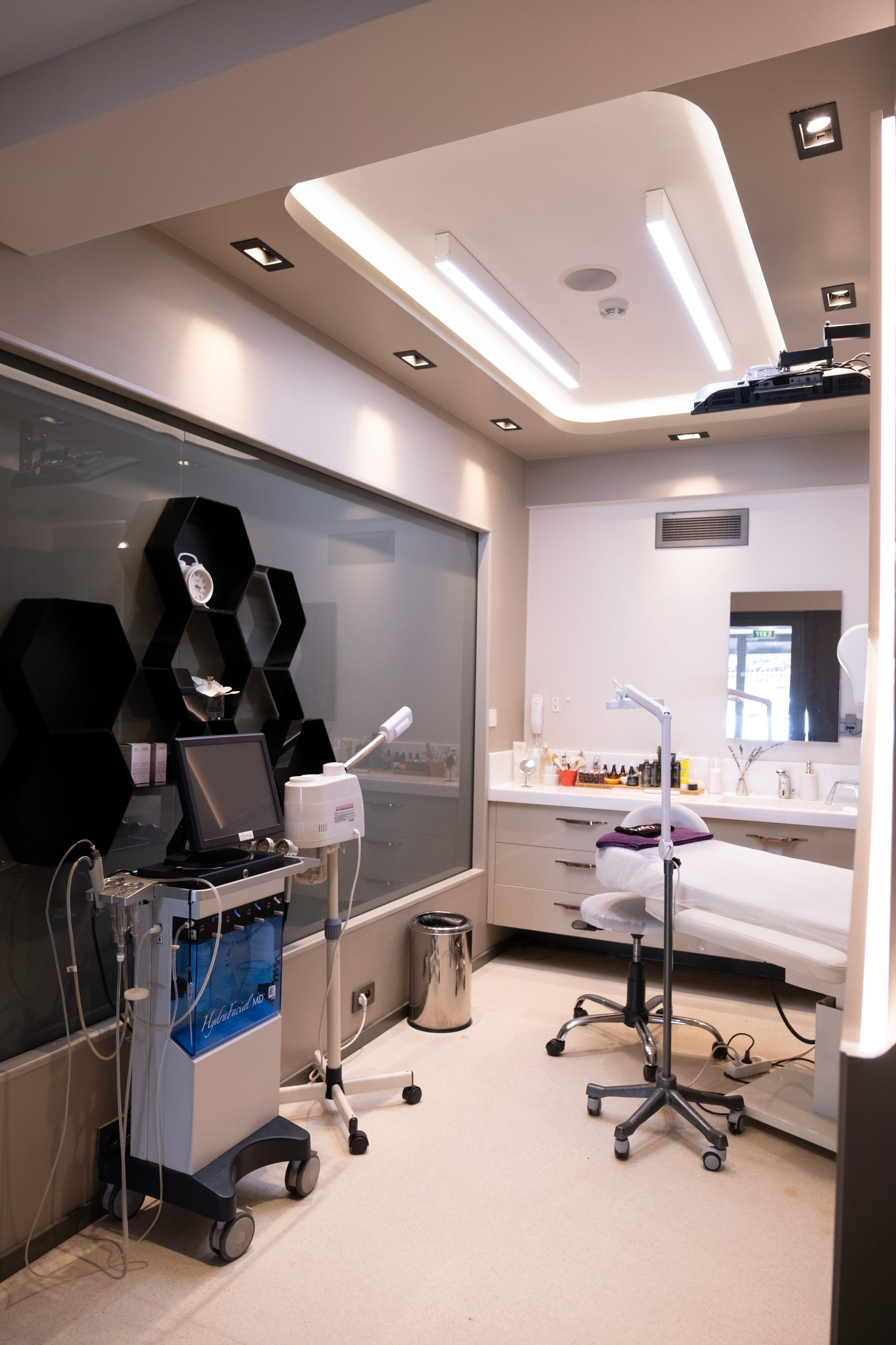 Modern aesthetic treatment room with contemporary medical equipment